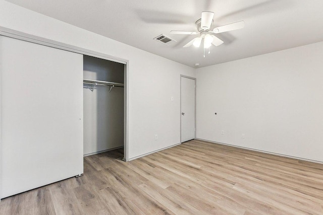 1208 Water Spaniel Way, Round Rock, TX 78664 - unfurnished bedroom with light wood-style flooring, a closet, and a ceiling fan