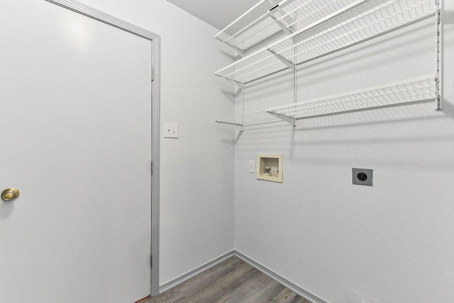 1208 Water Spaniel Way, Round Rock, TX 78664 - laundry area featuring washer hookup, hookup for an electric dryer, dark wood-style flooring, and baseboards