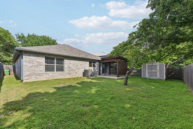 1208 Water Spaniel Way, Round Rock, TX 78664 - back of property with central air condition unit, a patio area, a storage shed, an outdoor structure, and roof with shingles