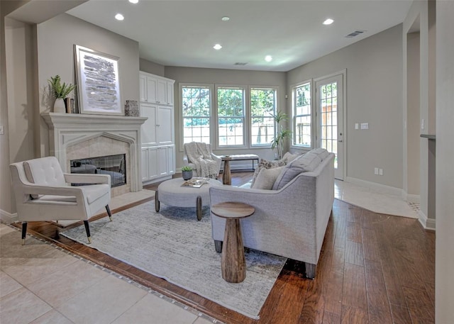 3508 Red River St, Austin, TX 78705 - living area featuring a premium fireplace, recessed lighting, baseboards, and light wood-type flooring
