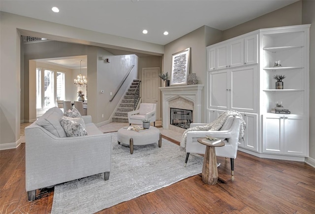 3508 Red River St, Austin, TX 78705 - living area with stairs, a chandelier, a premium fireplace, baseboards, and recessed lighting