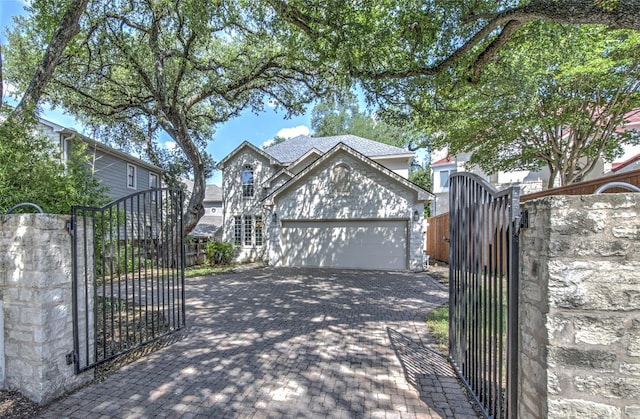 3508 Red River St, Austin, TX 78705 - view of front of house with a gate, a garage, and driveway