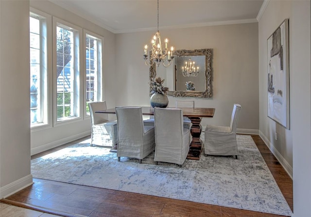 3508 Red River St, Austin, TX 78705 - dining area featuring a chandelier, baseboards, crown molding, and wood finished floors