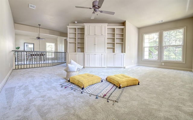 3508 Red River St, Austin, TX 78705 - living area with a ceiling fan, carpet, and baseboards