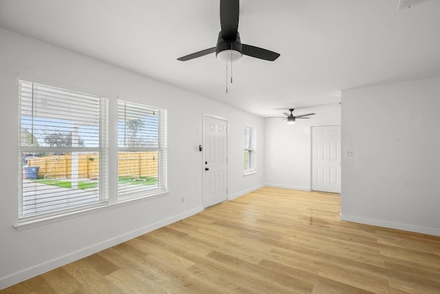 1317 Mckie Cv, Austin, TX 78752 - foyer with light wood-style floors, baseboards, and ceiling fan