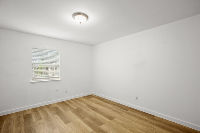 1317 Mckie Cv, Austin, TX 78752 - spare room with light wood-style flooring and baseboards