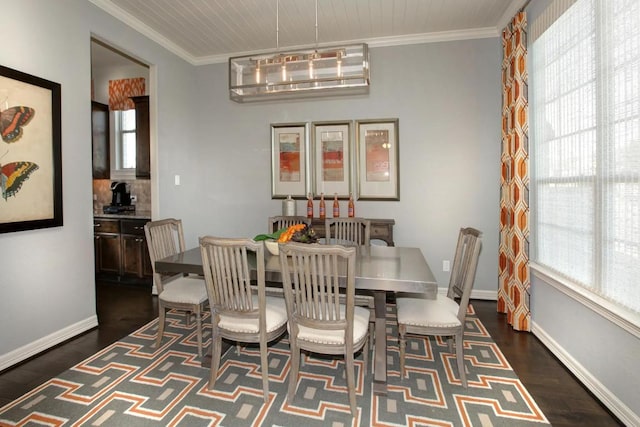 6716 Liberty Grotto Ct, Lago Vista, TX 78645 - dining area featuring healthy amount of natural light, dark wood-style flooring, crown molding, and baseboards