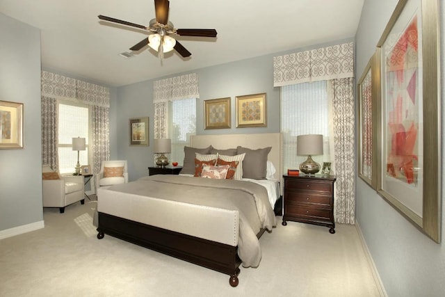 6716 Liberty Grotto Ct, Lago Vista, TX 78645 - carpeted bedroom featuring baseboards and a ceiling fan