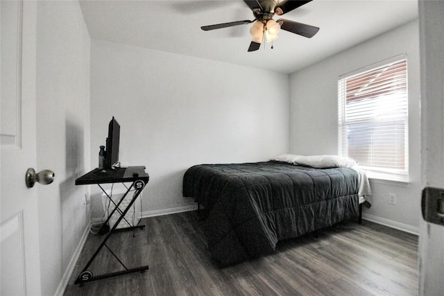 bedroom featuring wood finished floors, baseboards, and ceiling fan