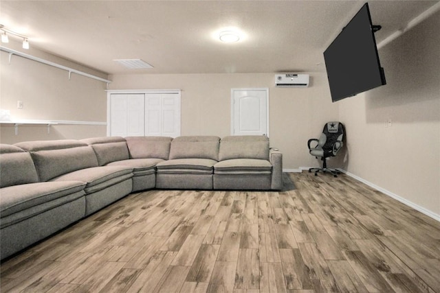 living room featuring wood finished floors and baseboards