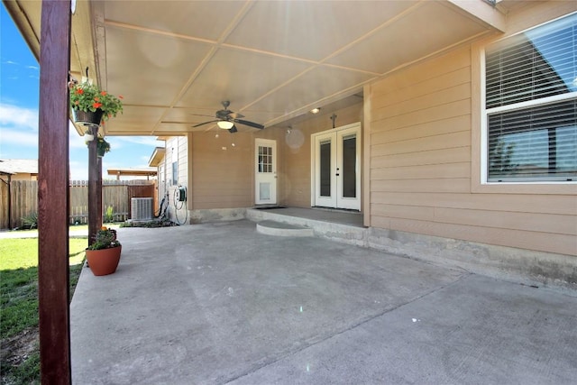 view of patio / terrace with french doors, ceiling fan, fence, and cooling unit
