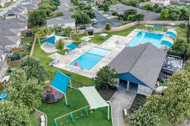 aerial view of residential area with a pool