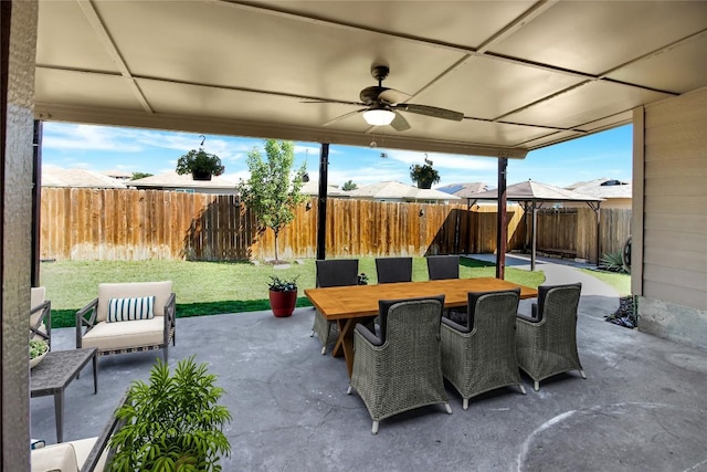view of patio with ceiling fan and outdoor dining space