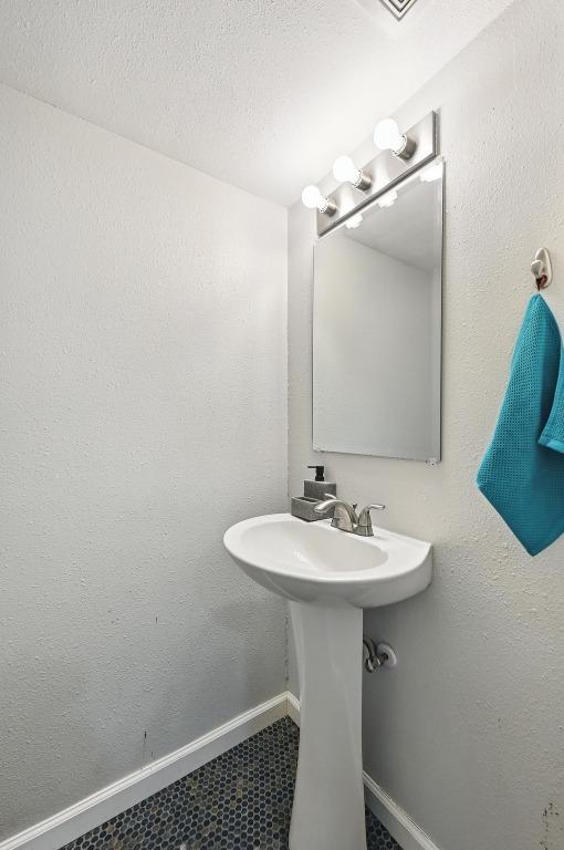 3820 Southway Dr Unit C, Austin, TX 78704 - bathroom featuring baseboards