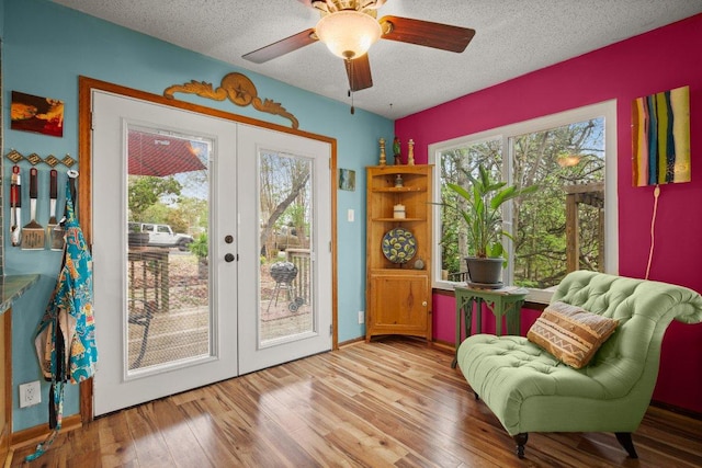 6906 Chinook Dr, Austin, TX 78736 - sitting room featuring french doors, a textured ceiling, wood finished floors, and ceiling fan