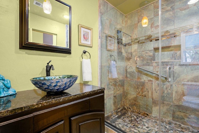 6906 Chinook Dr, Austin, TX 78736 - bathroom featuring a stall shower and vanity