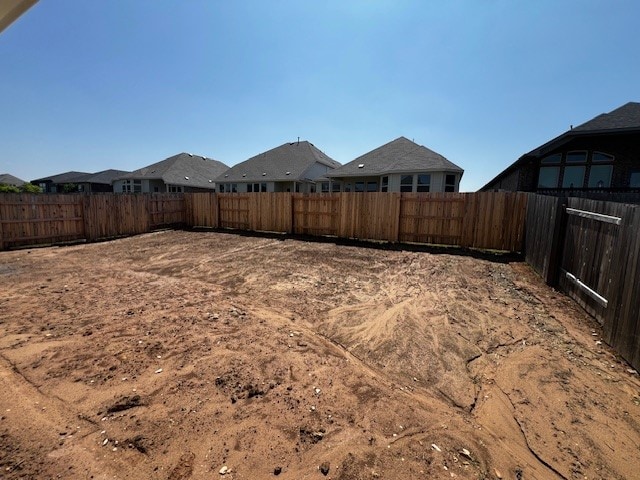 510 Durian Loop, Buda, TX 78610 - fenced backyard with a residential view