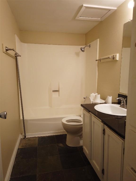 1000 W 26th St Unit 110, Austin, TX 78705 - bathroom featuring shower / bathtub combination, toilet, vanity, and baseboards