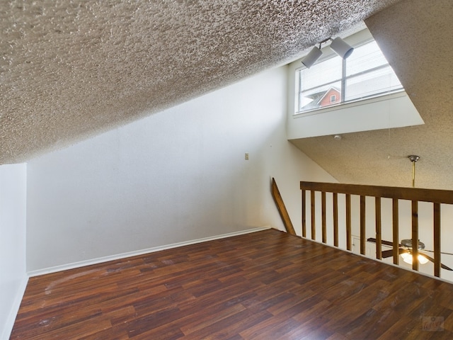 2210 Pearl St Unit 306, Austin, TX 78705 - additional living space with wood finished floors and vaulted ceiling