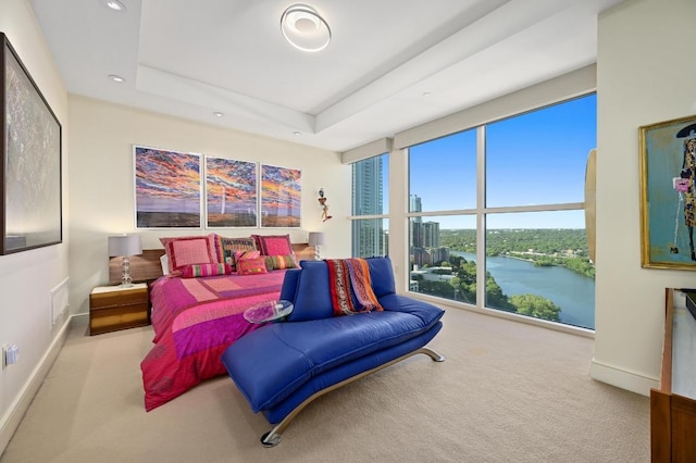 carpeted bedroom featuring baseboards