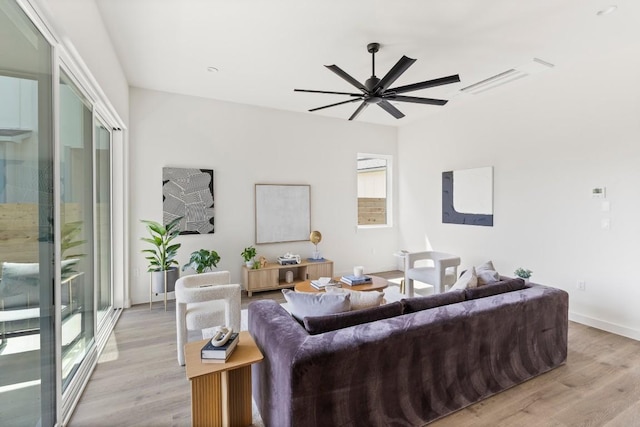 6308 Bristol Cir Unit A, Austin, TX 78723 - living room featuring light wood-style flooring, a ceiling fan, and baseboards