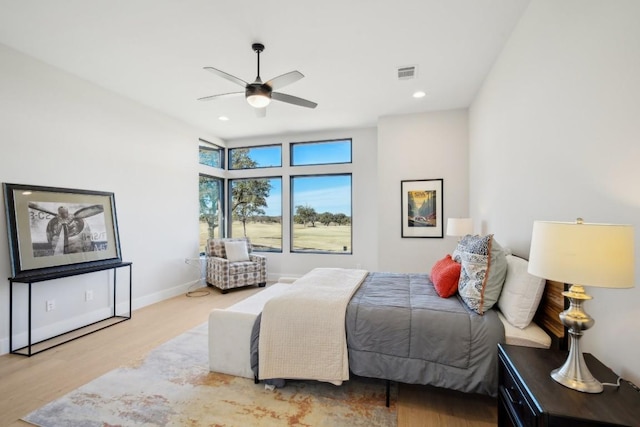2308 Kahala Sunset Dr, Spicewood, TX 78669 - bedroom featuring wood finished floors, ceiling fan, baseboards, and recessed lighting