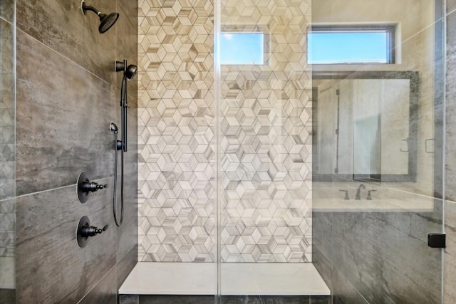 full bath with tiled shower