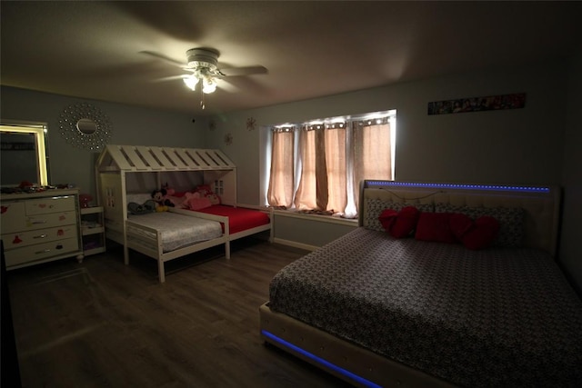 12302 Uttimer Ln, Austin, TX 78753 - bedroom with wood finished floors, baseboards, and ceiling fan