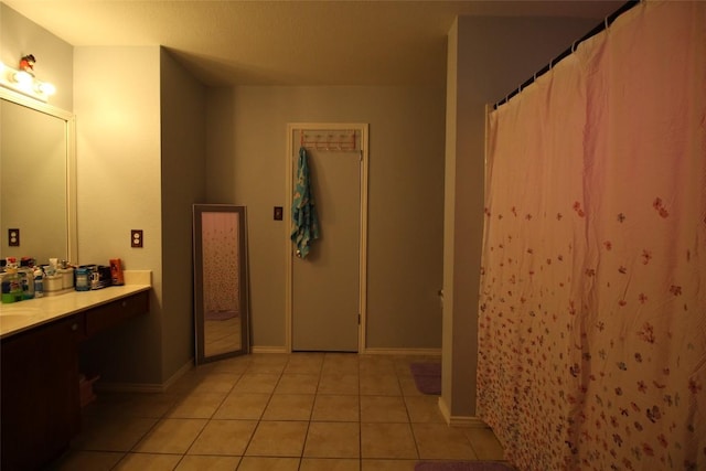 12302 Uttimer Ln, Austin, TX 78753 - full bath featuring vanity, tile patterned flooring, a shower with shower curtain, and baseboards