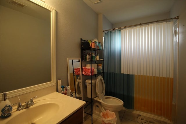12302 Uttimer Ln, Austin, TX 78753 - bathroom featuring toilet, vanity, and tile patterned flooring