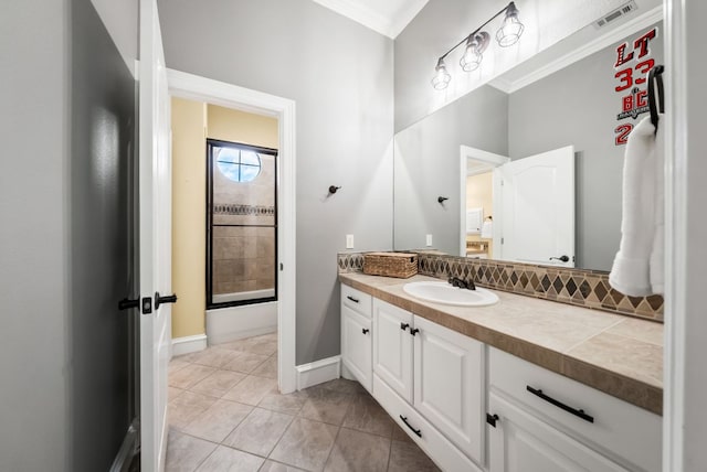 4020 Texas Wildlife Trl, Austin, TX 78735 - full bath with vanity, tile patterned flooring, crown molding, a shower, and baseboards