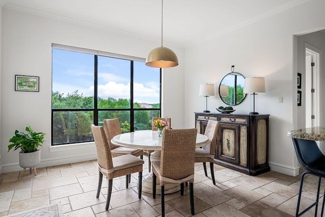4020 Texas Wildlife Trl, Austin, TX 78735 - dining room with stone tile flooring, crown molding, and baseboards