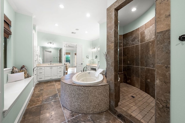 4020 Texas Wildlife Trl, Austin, TX 78735 - bathroom featuring stone tile floors, a garden tub, a walk in shower, vanity, and recessed lighting