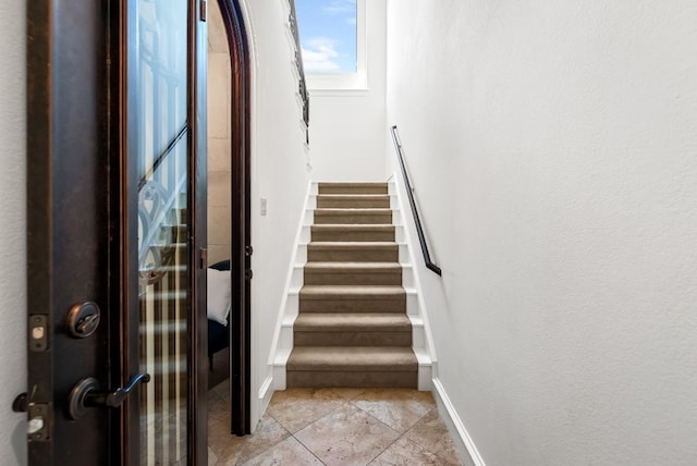 4020 Texas Wildlife Trl, Austin, TX 78735 - stairs with tile patterned floors and baseboards