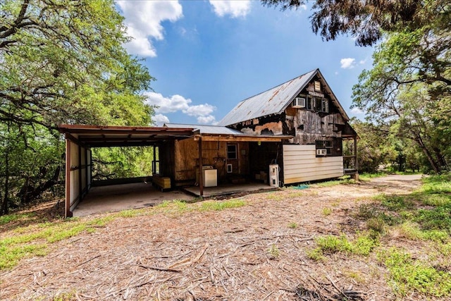990 Oak Mdws, San Marcos, TX 78666 - view of property exterior with metal roof and a carport
