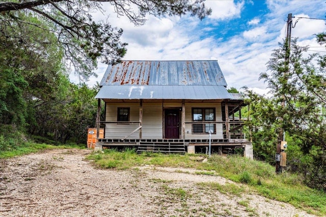 990 Oak Mdws, San Marcos, TX 78666 - view of front facade featuring a porch and metal roof