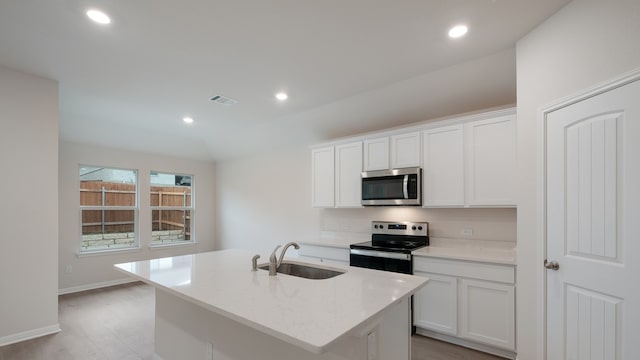 329 Lone Cedar Rd, Marble Falls, TX 78654 - kitchen featuring appliances with stainless steel finishes, a sink, a center island with sink, white cabinets, and recessed lighting