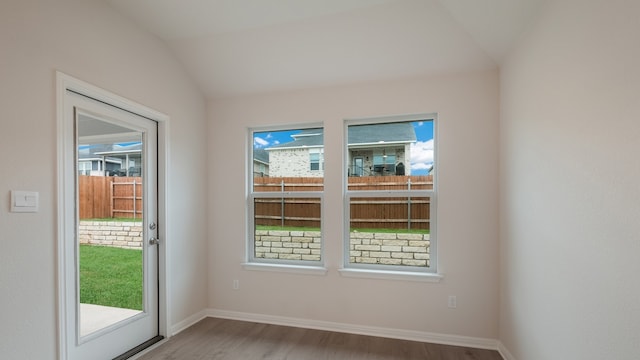 329 Lone Cedar Rd, Marble Falls, TX 78654 - doorway featuring wood finished floors, lofted ceiling, and baseboards
