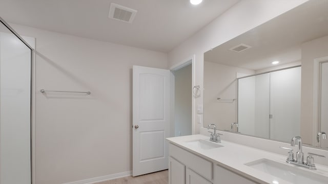 329 Lone Cedar Rd, Marble Falls, TX 78654 - bathroom with a shower stall, recessed lighting, double vanity, wood finished floors, and baseboards