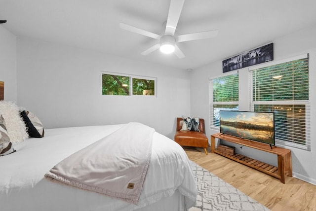 bedroom with wood finished floors and a ceiling fan