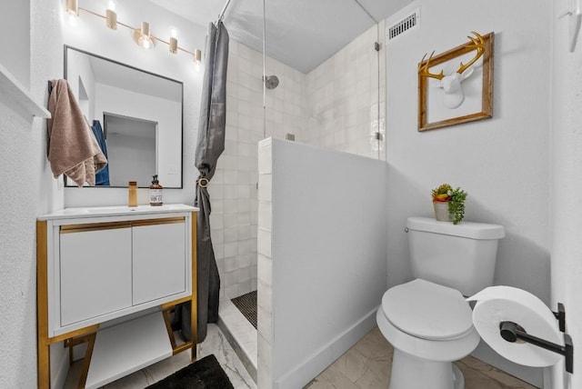bathroom with marble finish floors, walk in shower, toilet, and vanity