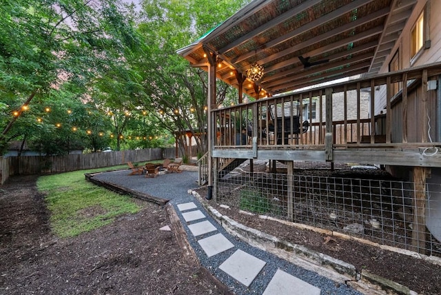 fenced backyard featuring an outdoor fire pit and a patio area