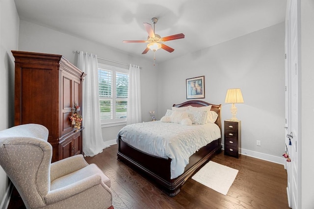 128 Tuscany Way, Georgetown, TX 78633 - bedroom featuring baseboards, dark wood finished floors, and ceiling fan