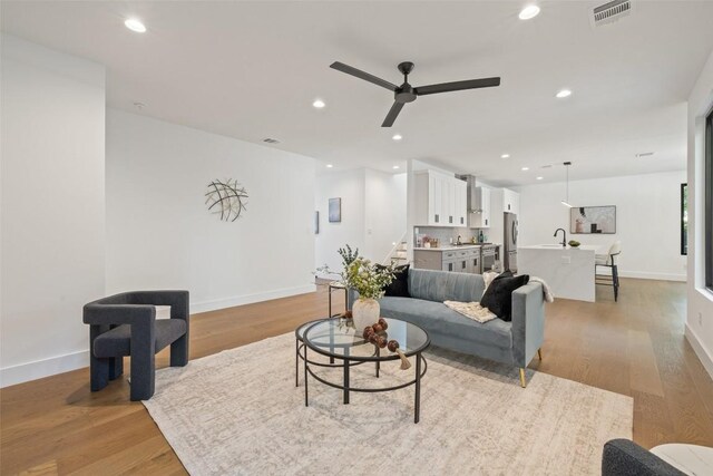 3705 Wilson St Unit 1, Austin, TX 78704 - living room featuring ceiling fan, light wood-type flooring, stairs, and recessed lighting