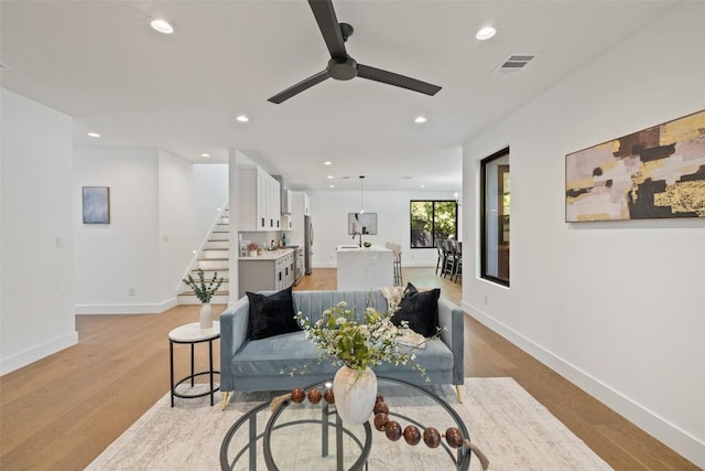 3705 Wilson St Unit 1, Austin, TX 78704 - living room featuring a ceiling fan, stairs, recessed lighting, and light wood-style floors