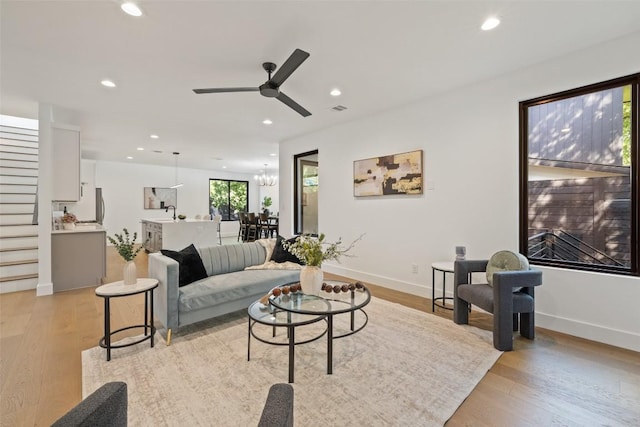 3705 Wilson St Unit 1, Austin, TX 78704 - living area with light wood-style floors, recessed lighting, a ceiling fan, and a chandelier