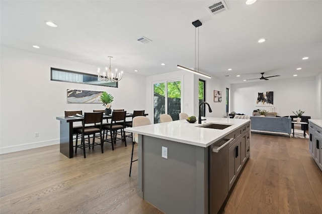 3705 Wilson St Unit 1, Austin, TX 78704 - kitchen featuring stainless steel dishwasher, recessed lighting, wood finished floors, and light countertops