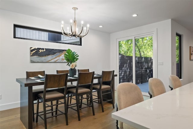 3705 Wilson St Unit 1, Austin, TX 78704 - dining room with wood finished floors, a chandelier, and recessed lighting