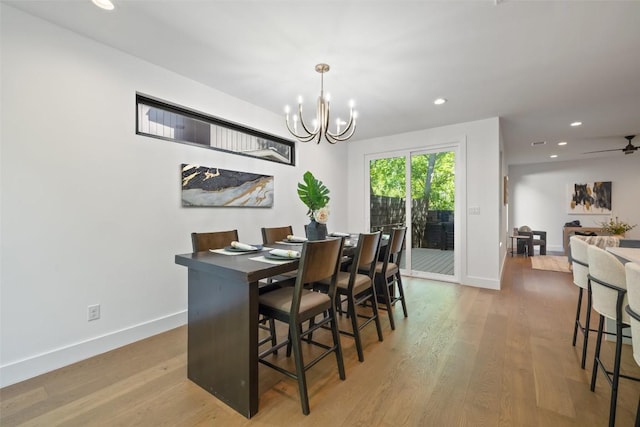 3705 Wilson St Unit 1, Austin, TX 78704 - dining area featuring a chandelier, wood finished floors, recessed lighting, and a ceiling fan
