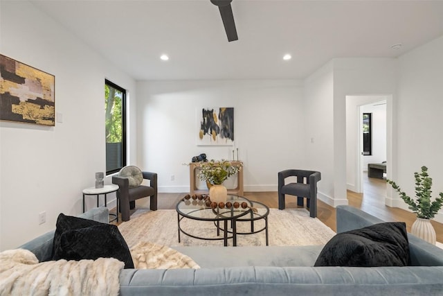 living room with ceiling fan, recessed lighting, wood finished floors, and baseboards
